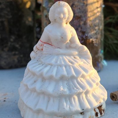 Yesterday while digging a privy in Baltimore city we unearthed this figurine. Its a women in a...jpg