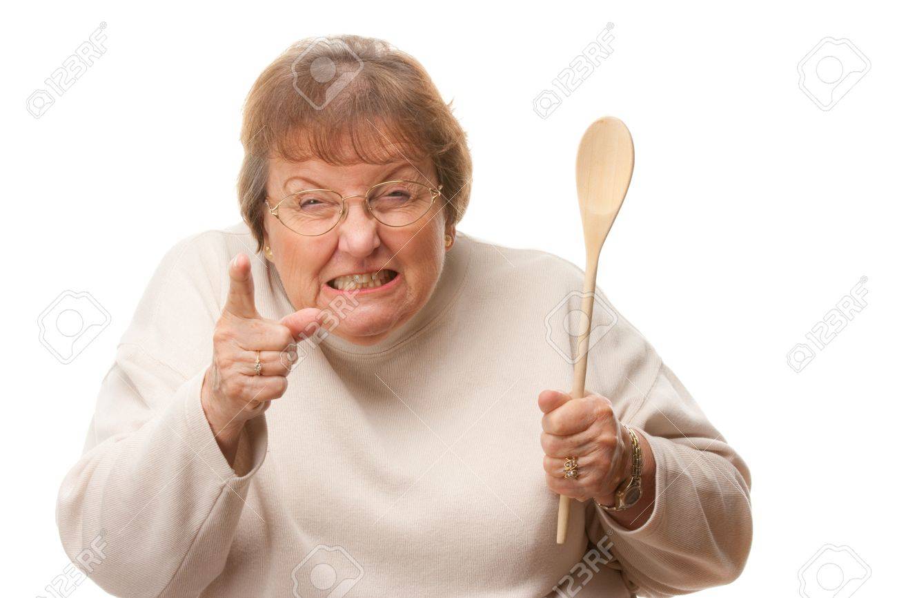 4176204-upset-senior-woman-with-the-wooden-spoon-isolated-on-a-white-background.jpg